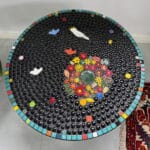 Irajs Mosaic Table using ceramic flowers, leaves, ladybirds, birds, cockatoo, circlies, daisies from Mosaic Inspiration